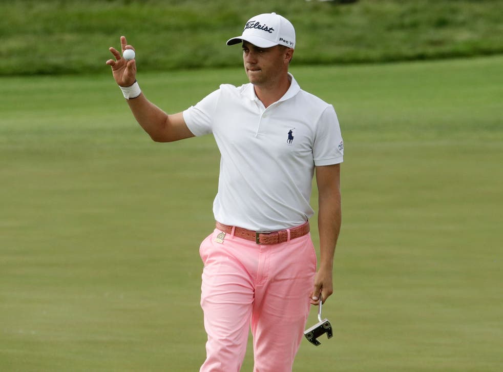 Justin Thomas reacts after his birdie on the 17th hole during the third round of the U.S. Open golf tournament Saturday, June 17, 2017, at Erin Hills