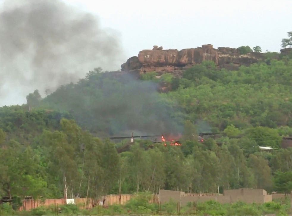 Flames rise following an attack where gunmen stormed Le Campement Kangaba resort in Dougourakoro, to the east of the capital Bamako, Mali in this still frame taken from video June 18, 2017.