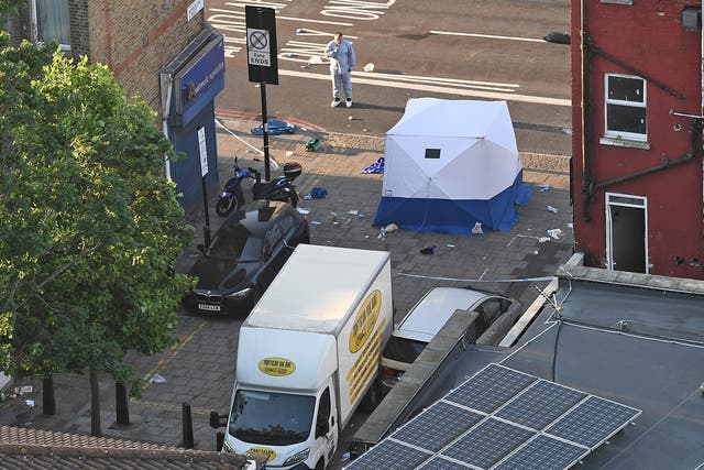 Police forensics specialists examine the van used in the recent Finsbury Park Mosque attack in London