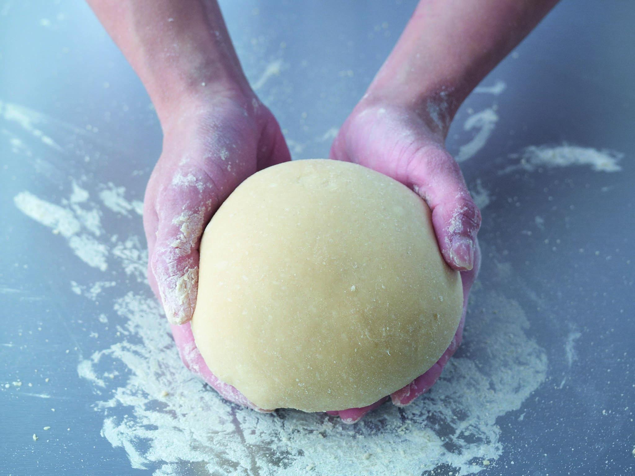 5. Place the dough on to a lightly floured surface and start to knead it