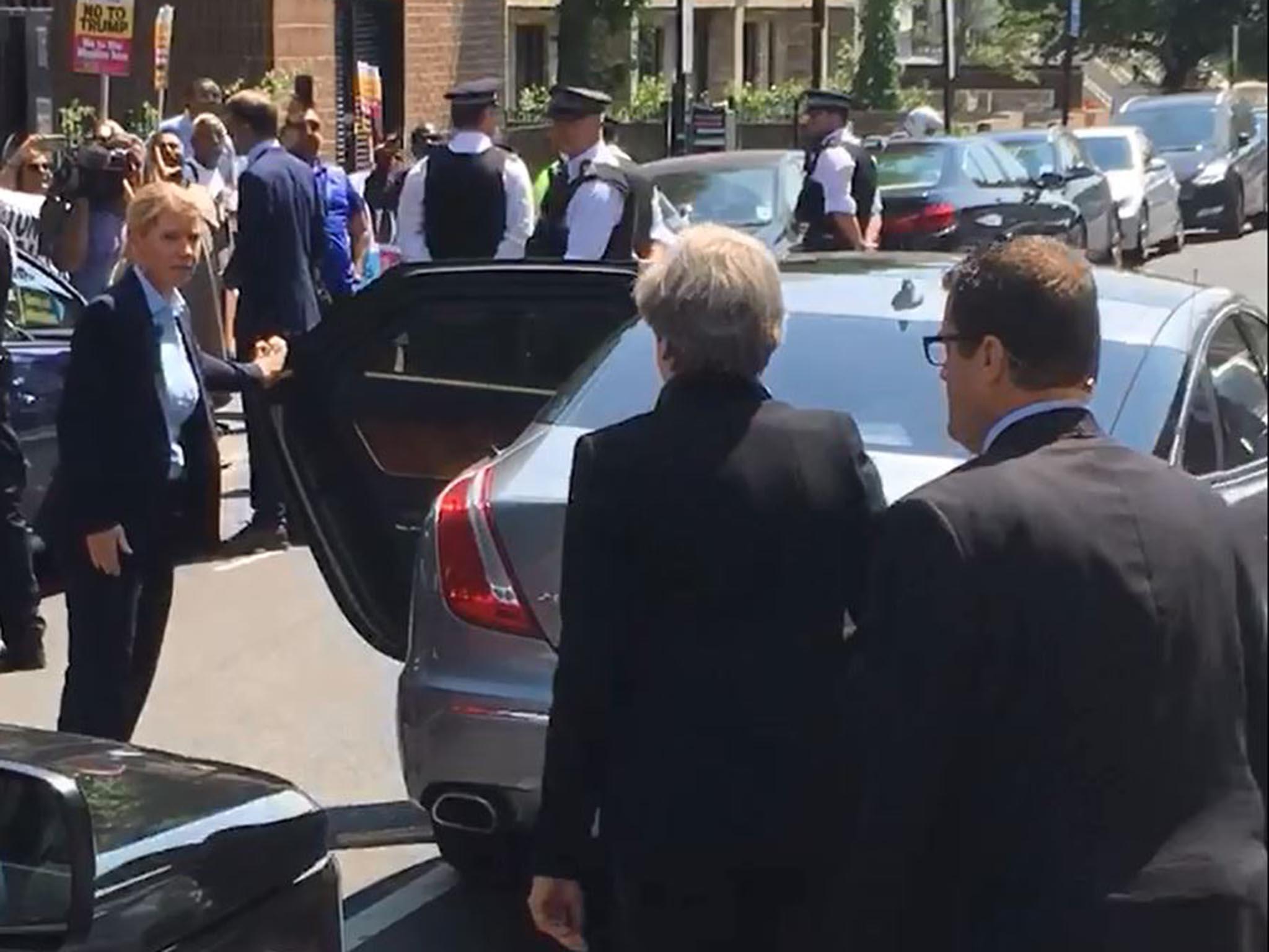 Theresa May leaves Finsbury Park Mosque to heckling from those gathered outside