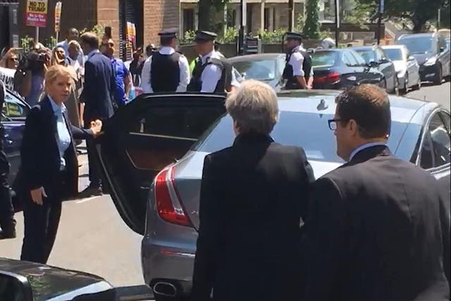 Theresa May leaves Finsbury Park Mosque to heckling from those gathered outside