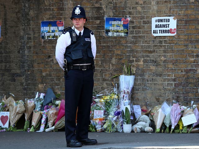 Tributes and flowers at a police cordon in Finsbury Park following a vehicle attack on pedestrians