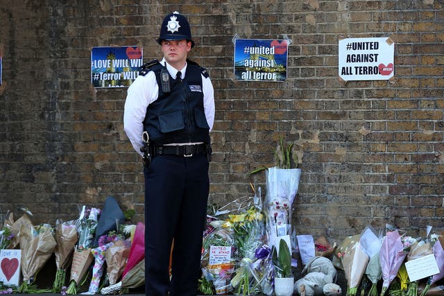 Tributes and flowers at a police cordon in Finsbury Park following a vehicle attack on pedestrians