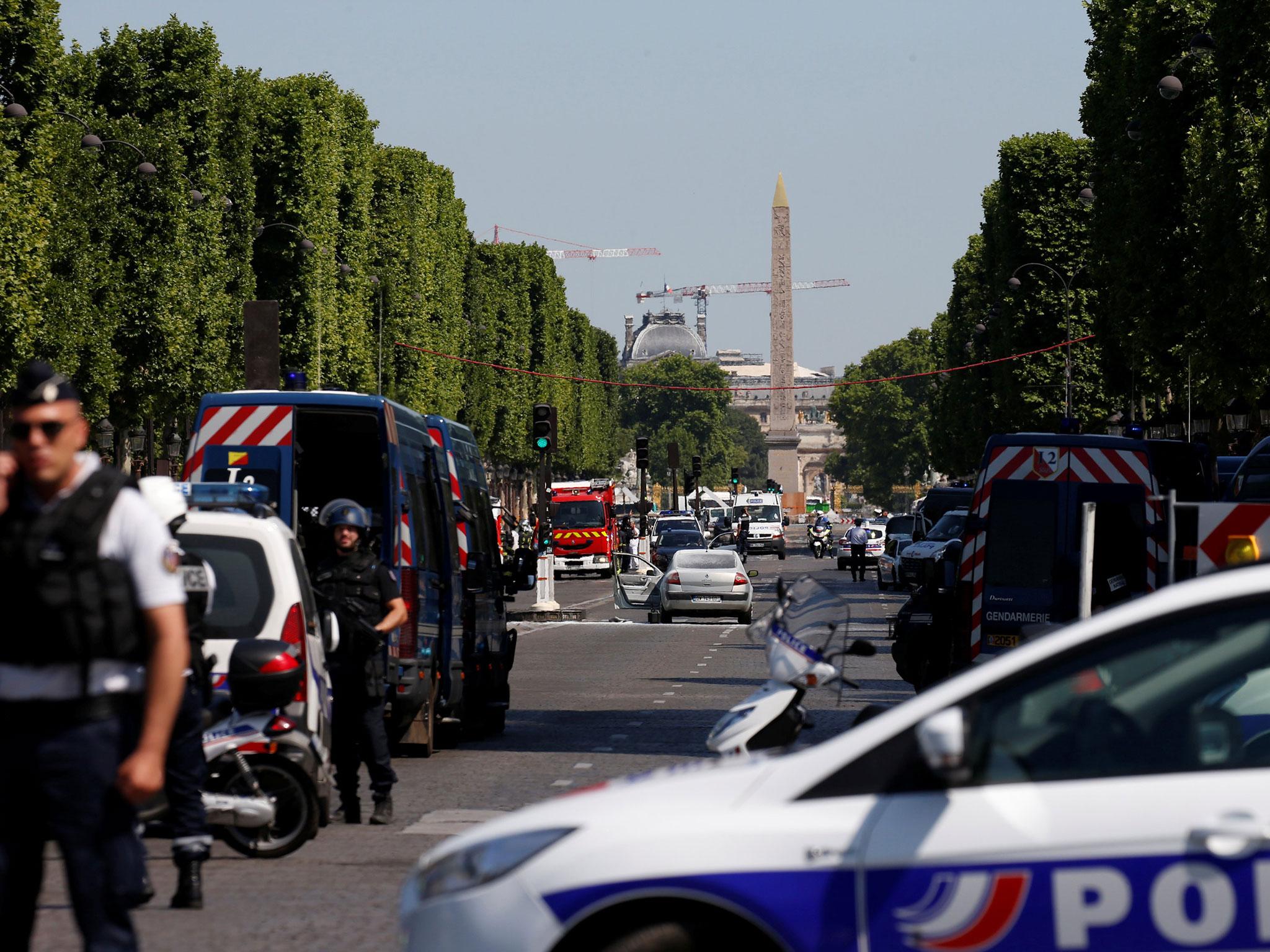 French police secure the area on the Champs Elysees avenue after an incident in Paris, France, 19 June 2017
