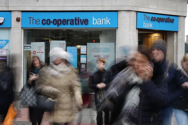 Members of the public walk past the Co-op Bank
