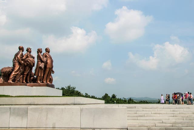 Tourists like these, visiting a ‘template’ farm village in Pyongyang, are morally wrong, says this writer