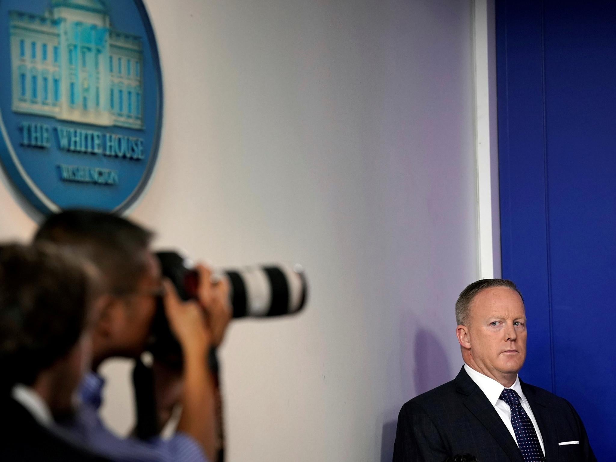 White House Press Secretary Sean Spicer looks at a photographer during the daily briefing