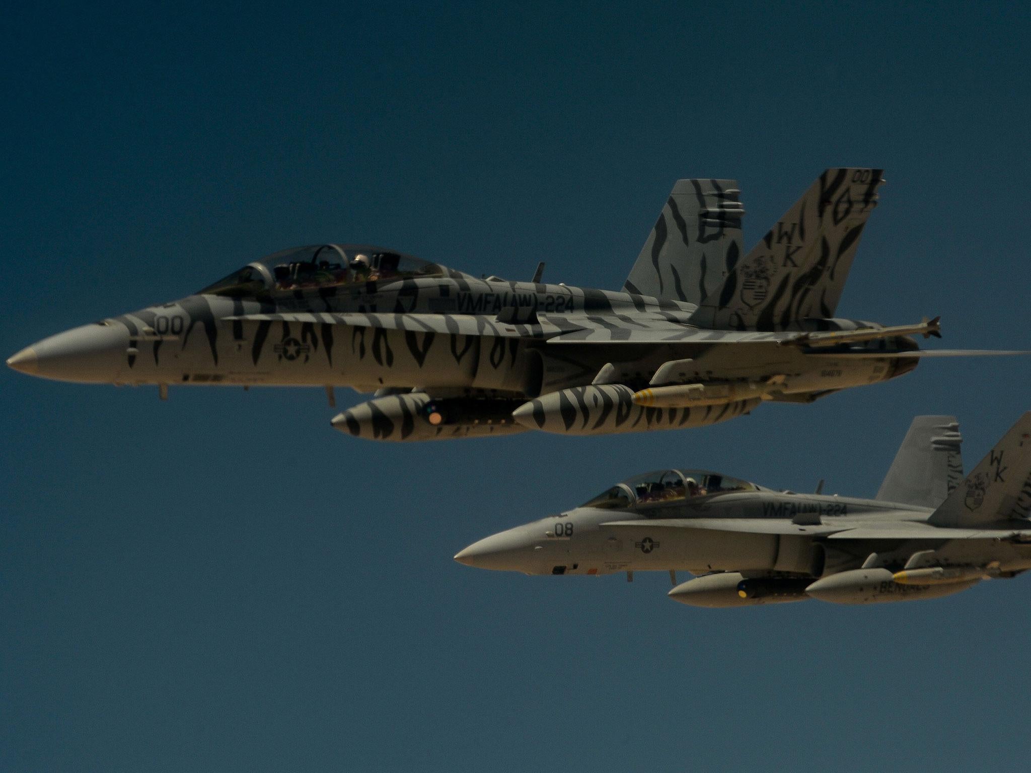 Warning: Moscow believes US jets such as these F18s are in breach of international law in engaging Syrian targets