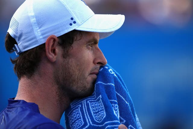 Andy Murray looks on after his shock defeat