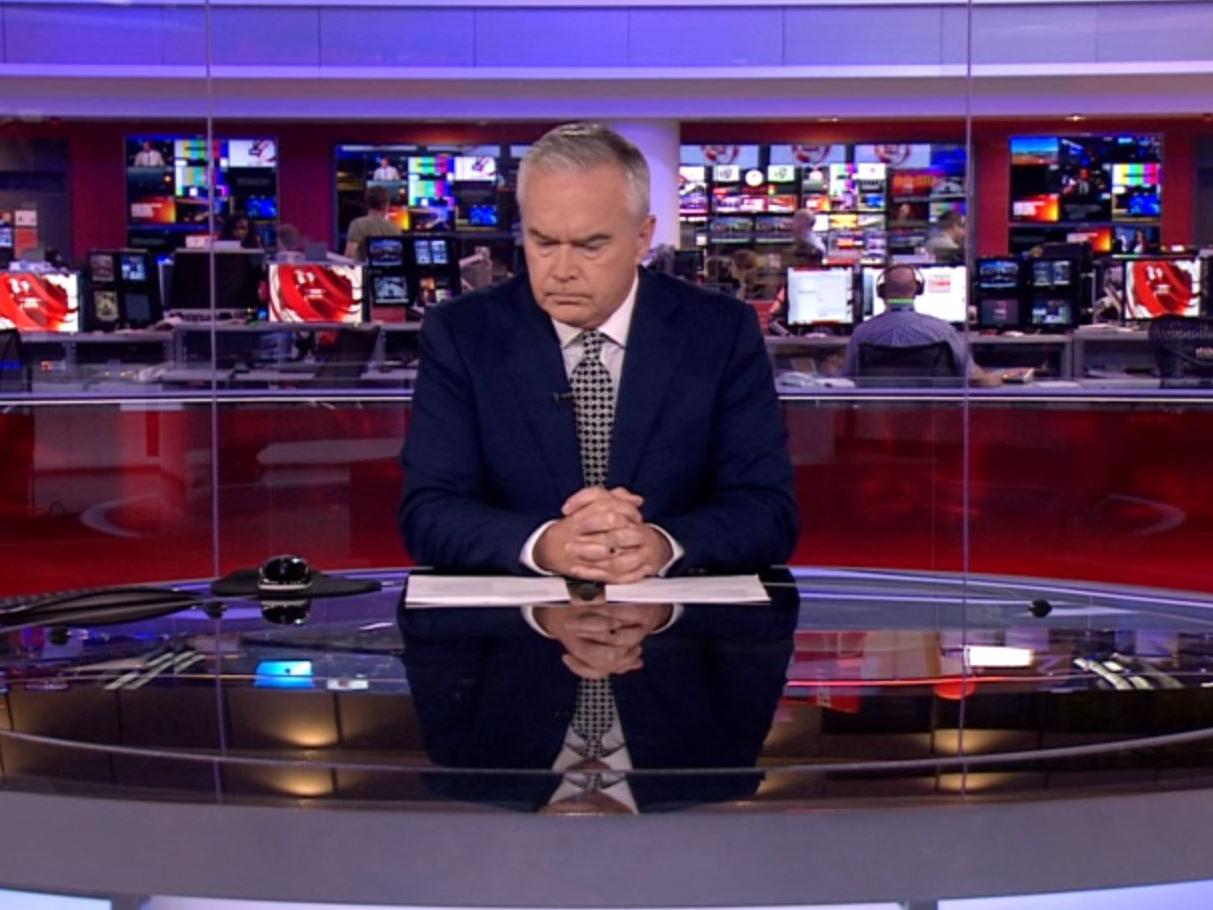 Waiting to begin: Huw Edwards professionalism was praised but viewers wondered what he was writing