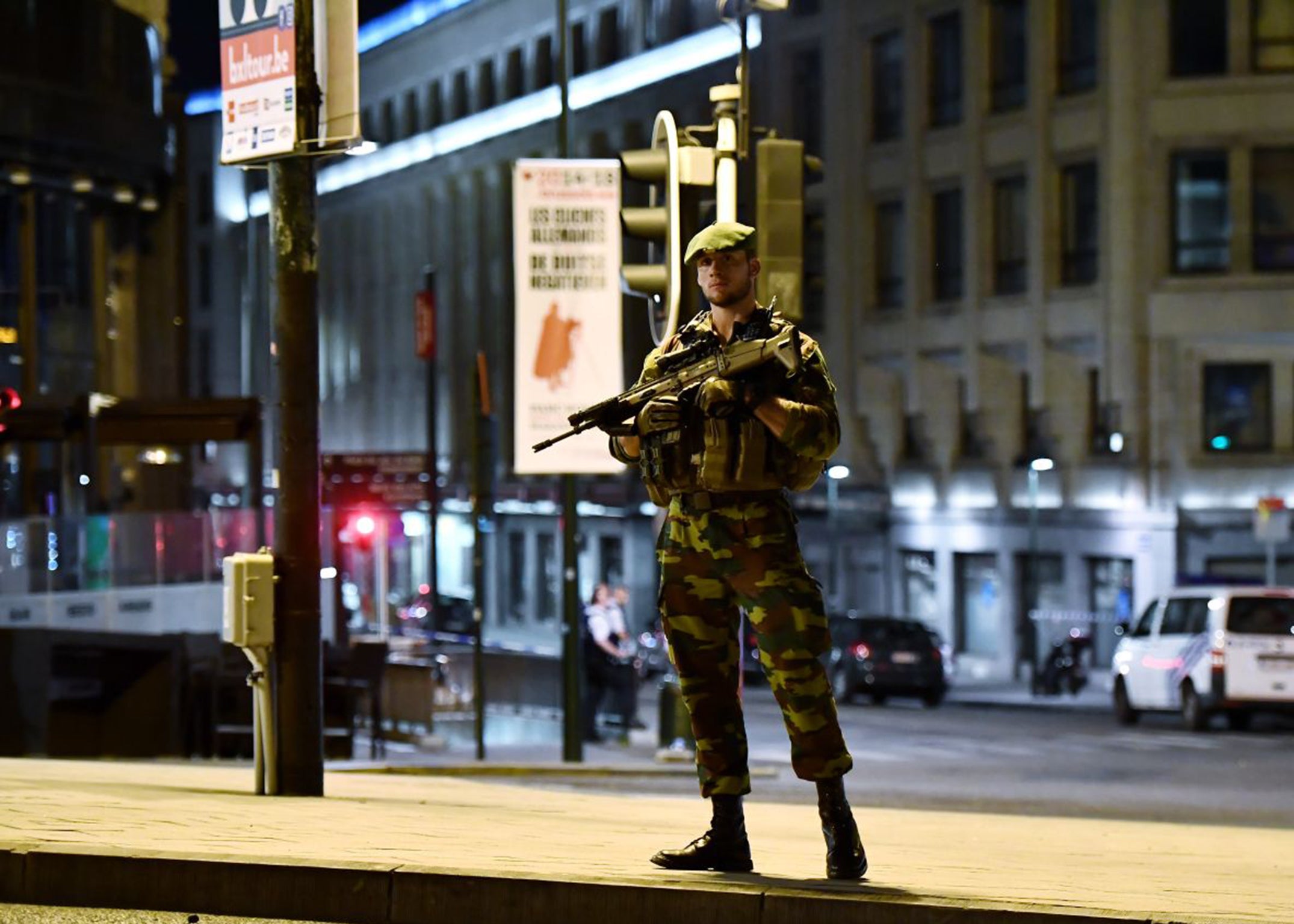 Police stand guard outside Brussels Central Station last night