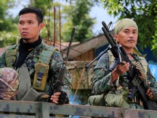 Isis-linked militants storm school and take hostages in Philippines