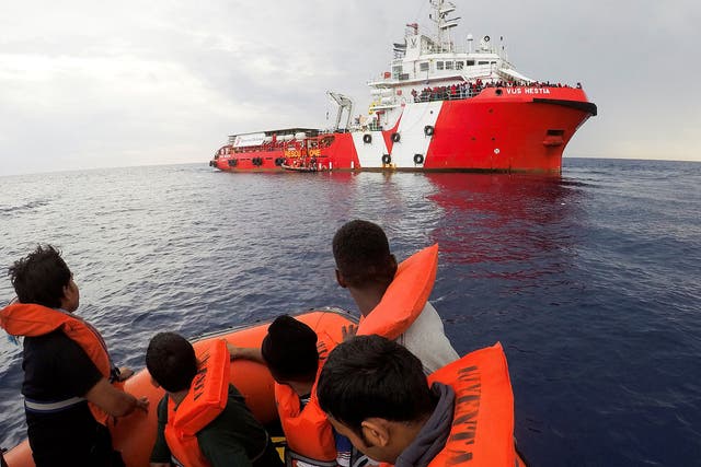 Migrants rescued by Save the Children’s crew approach the ship Vos Hestia in the Mediterranean off Libya’s coast