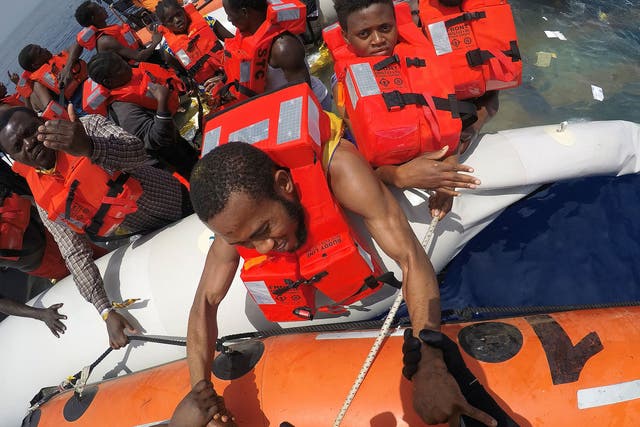 Migrants on a dinghy are rescued by Save the Children NGO crew from the ship ‘Vos Hestia’ off the coast of Libya, 17 June 2017