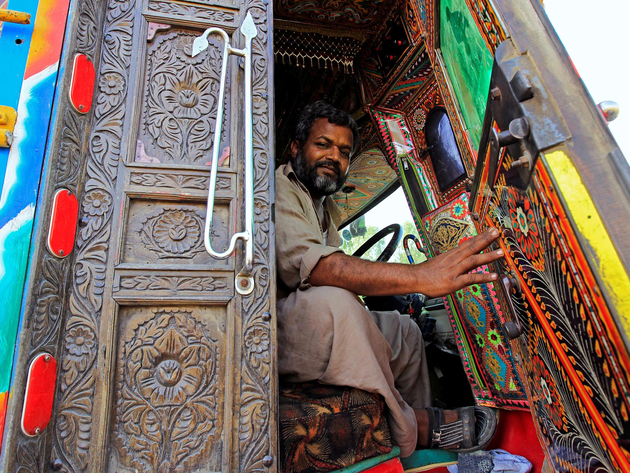 Not your average lorry: this driver enters his cab through carved-wood-panel doors