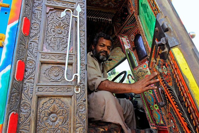 Not your average lorry: this driver enters his cab through carved-wood-panel doors
