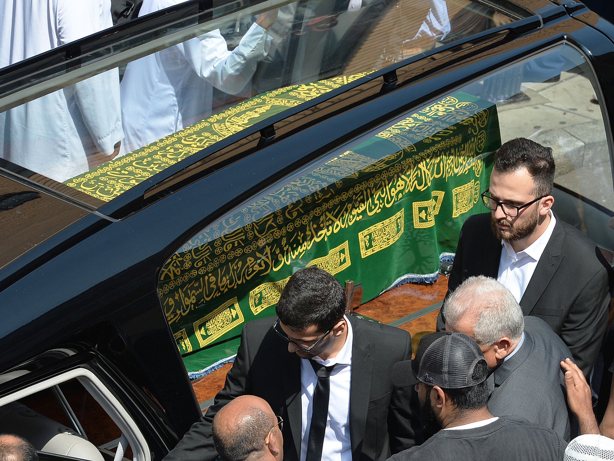 The coffin of Mohammad Alhajali, a victim of the deadly Grenfell Tower blaze, is taken from the east London Mosque in Whitechapel, for his burial.