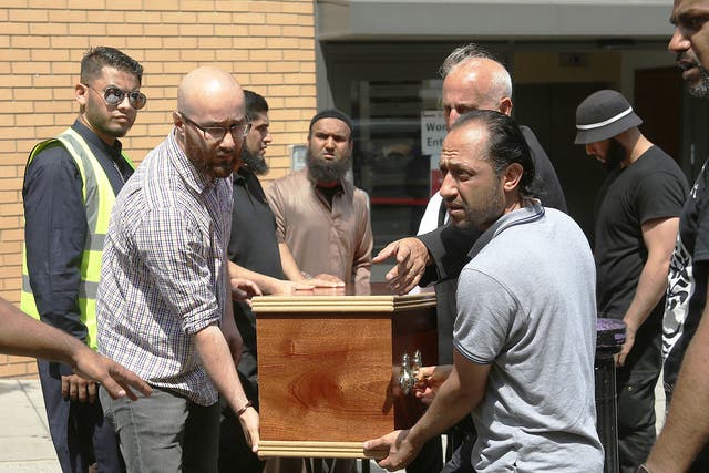 The coffin of Mohammad Alhajali, a victim of the deadly Grenfell Tower blaze, is taken from the east London Mosque in Whitechapel, for his burial.