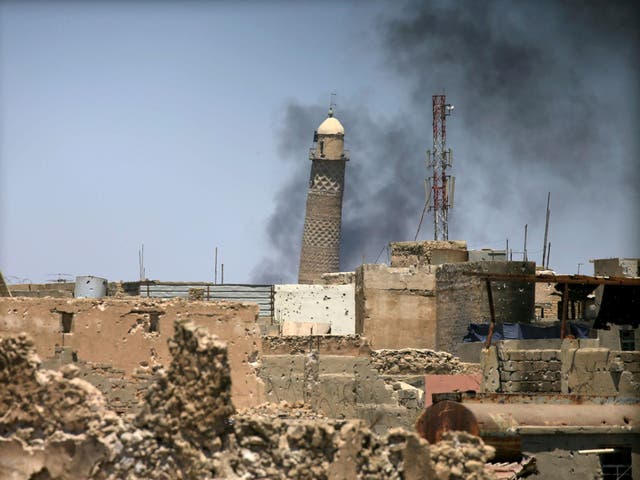 Al-Hadba minaret at the Grand Mosque seen in the old city of Mosul, in a photo taken 1 June, 2017