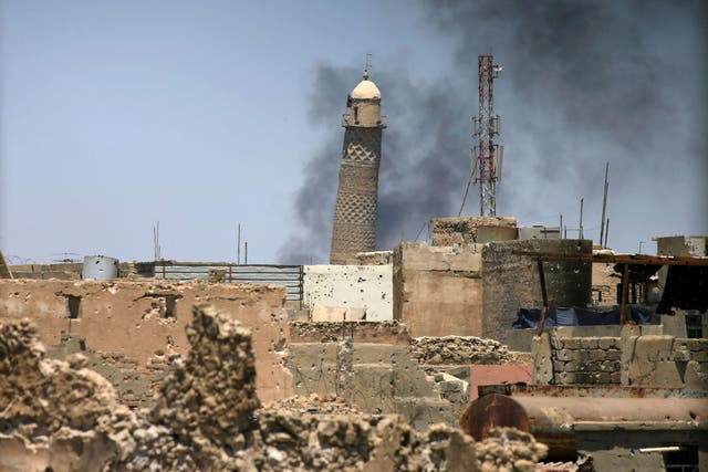Al-Hadba minaret at the Grand Mosque seen in the old city of Mosul, in a photo taken 1 June, 2017