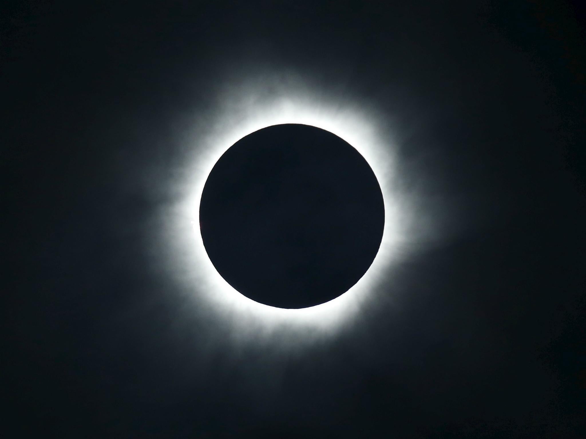 A total solar eclipse is seen from the beach of Ternate island, Indonesia, March 9, 2016