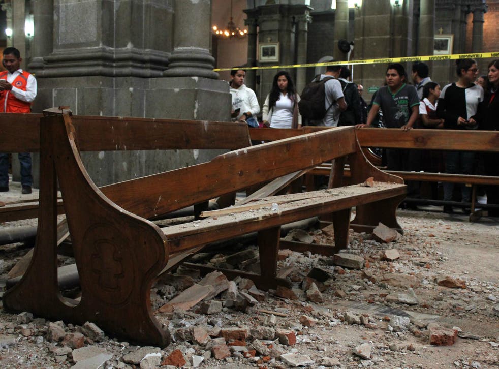 View of damage caused inside a church by a 6.9 magnitude earthquake in Quetzaltenango, 220 km from Guatemala City, on 14 June 2017