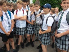 Boys wear skirts to school to protest against 'no shorts' policy