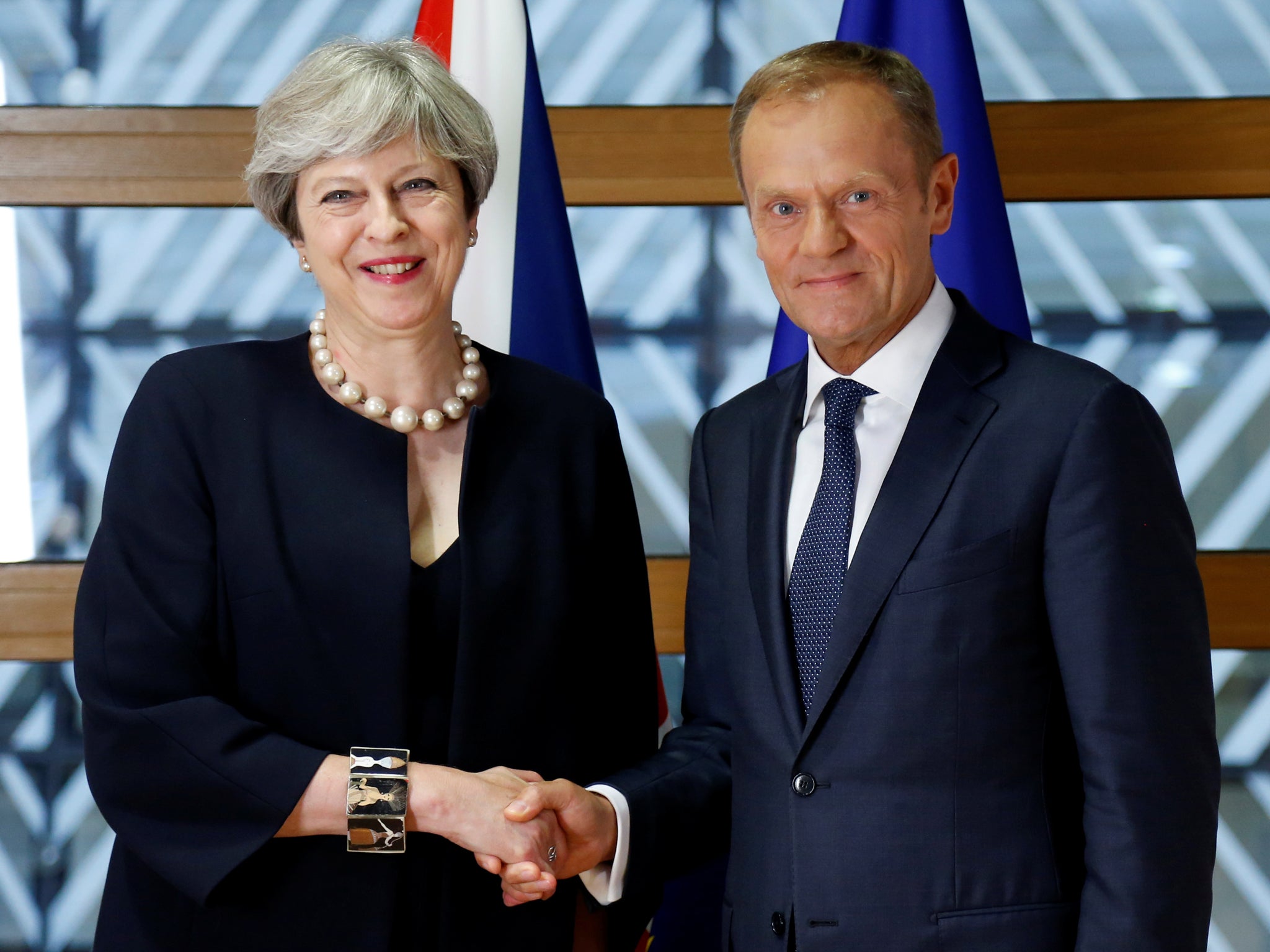 Prime Minister Theresa May and European Council President Donald Tusk pose during an EU leaders summit in Brussels