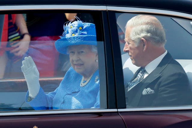 The Queen leaves Buckingham Palace with Prince Charles to travel Parliament for her speech