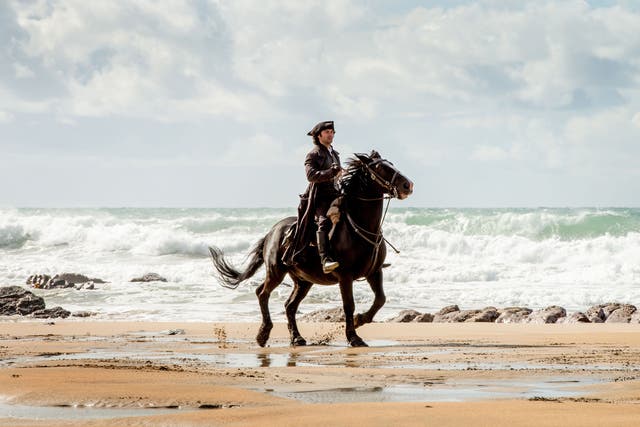 Riding out: Ross Poldark (Aidan Turner) on the beach
