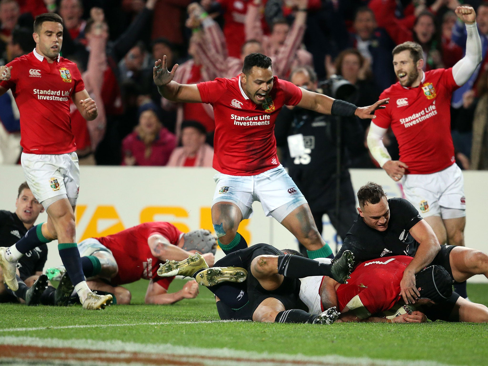 The Lions celebrate scoring their first try