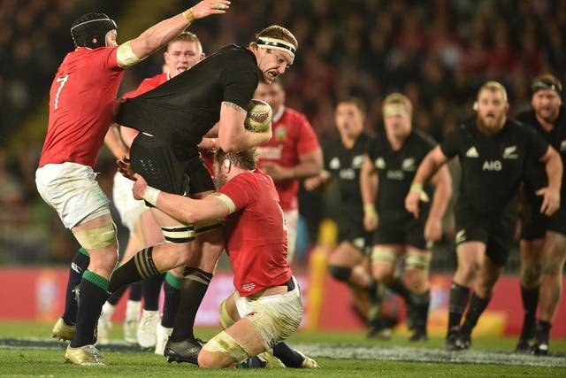 Brodie Retallick charges into Alun Wyn Jones and Sean O'Brien during the first Test between the All Blacks and British and Irish Lions