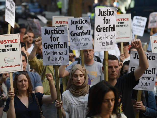 Protesters attend a rally calling for justice for those affected by the Grenfell Tower fire