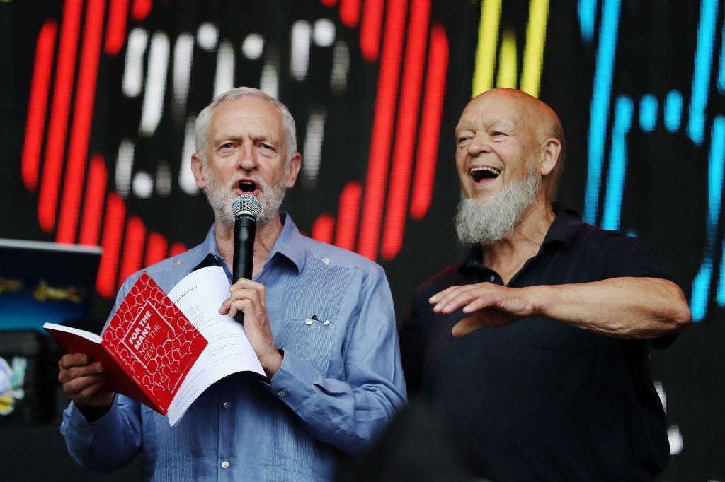 Labour party leader Jeremy Corbyn addresses the crowd alongside Glastonbury organiser Michael Eavis on the Pyramid Stage as he makes a guest appearance at the Glastonbury Festival Site, 24 June 2017