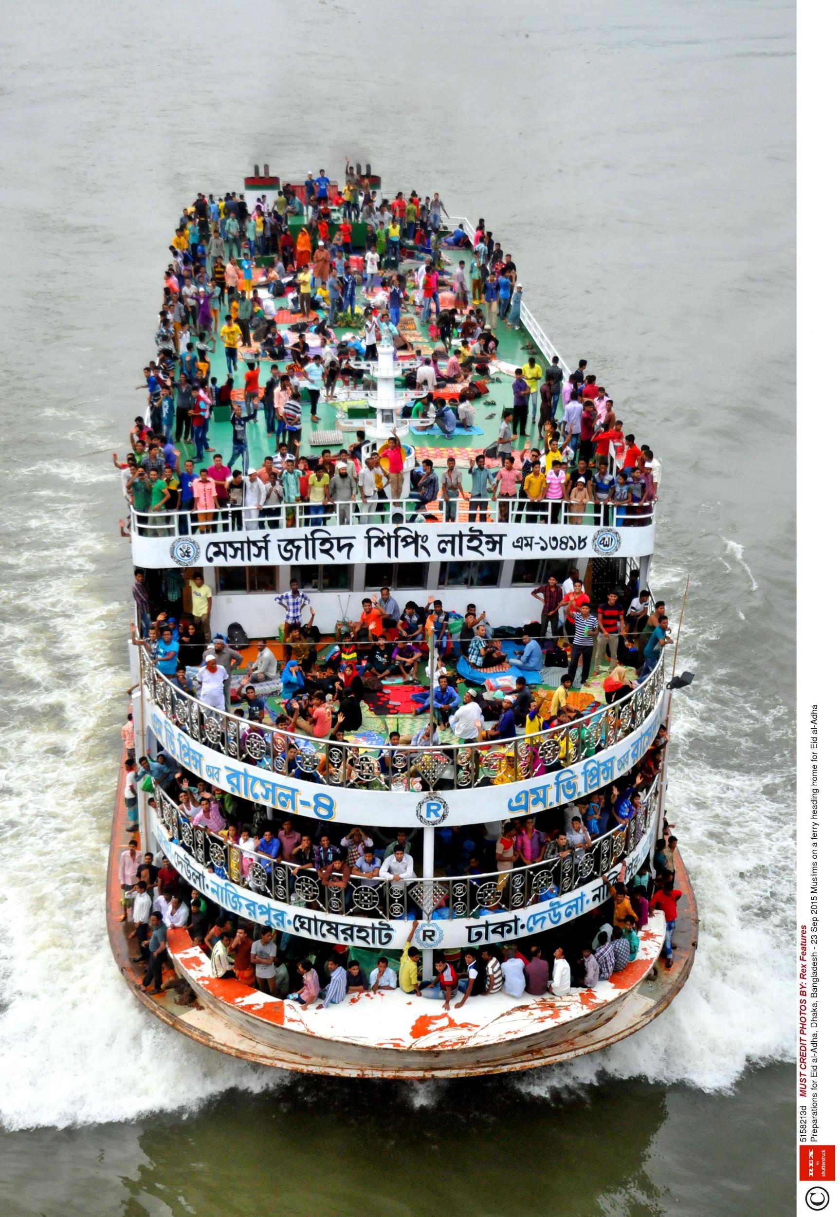 Bangladeshi Muslims travel home for celebrations on a crowded ferry in Dhaka