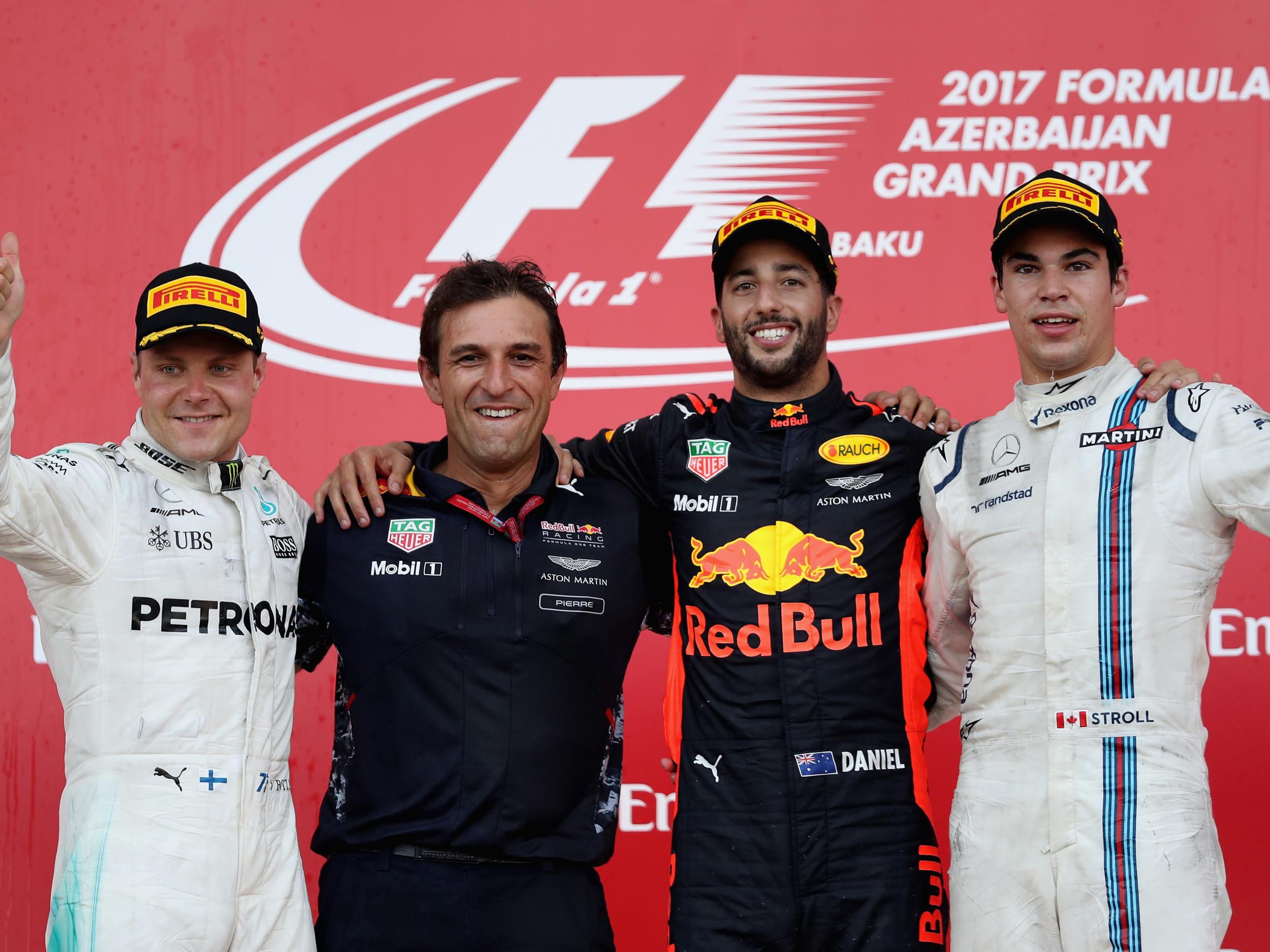 Bottas (left), Ricciardo (centre right) and Stroll (right) celebrate on the podium