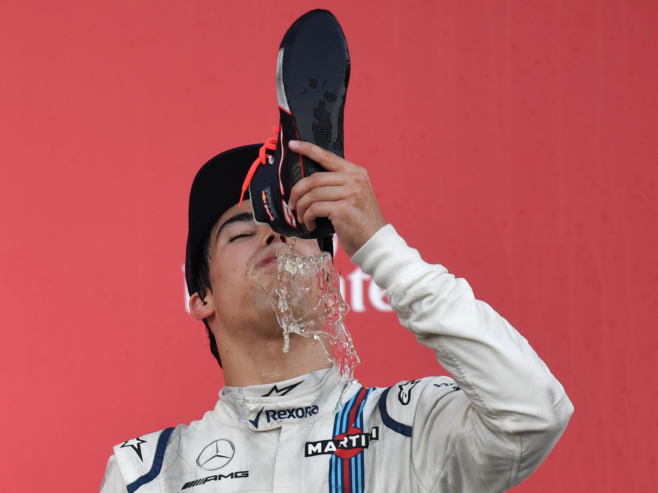 Lance Stroll does a 'shoey' in honour of his Australian rival Ricciardo