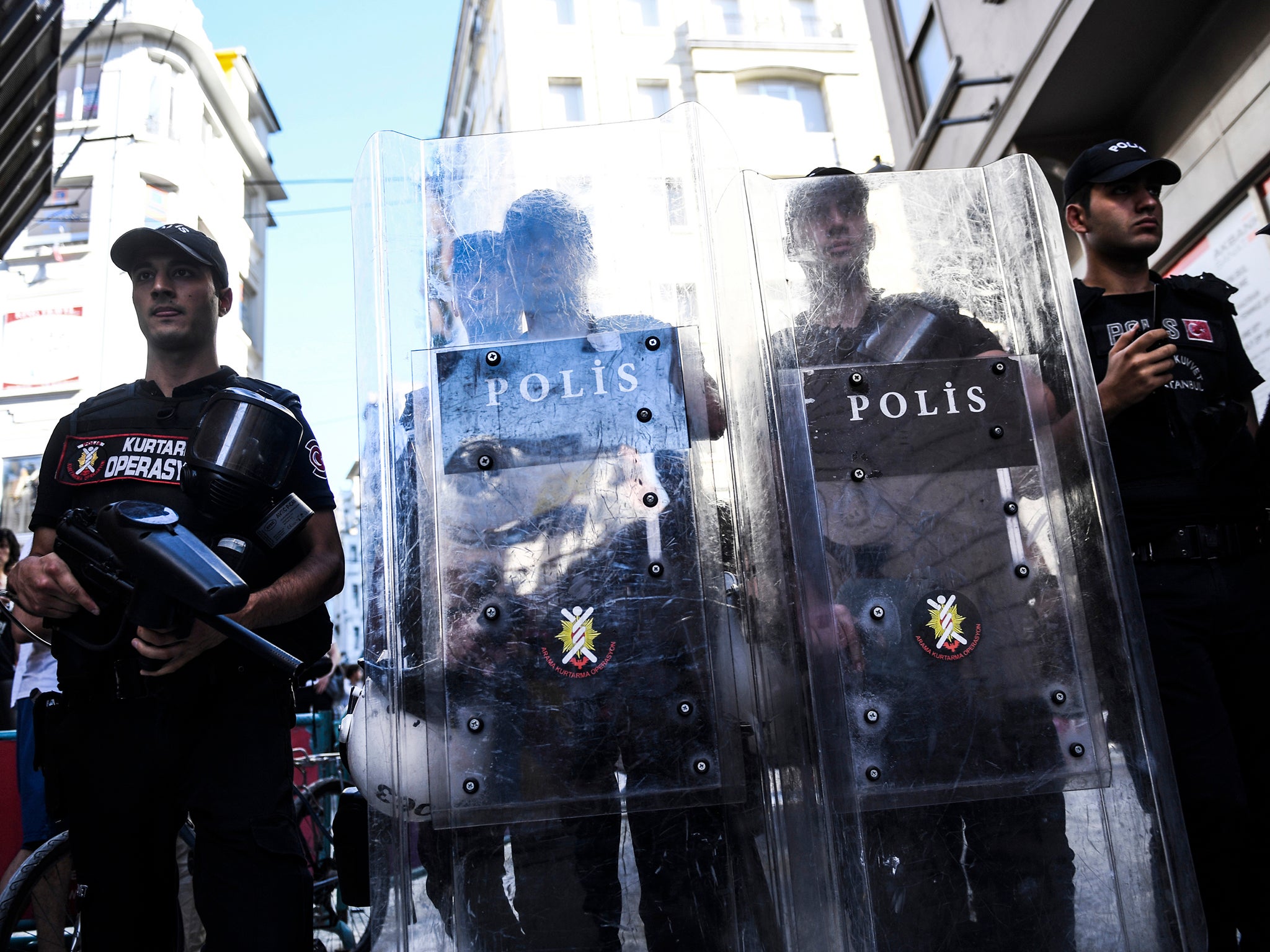 Turkish riot police officers block an access to Istiklal avenue to prevent LGBT rights activists from going ahead with a Gay Pride