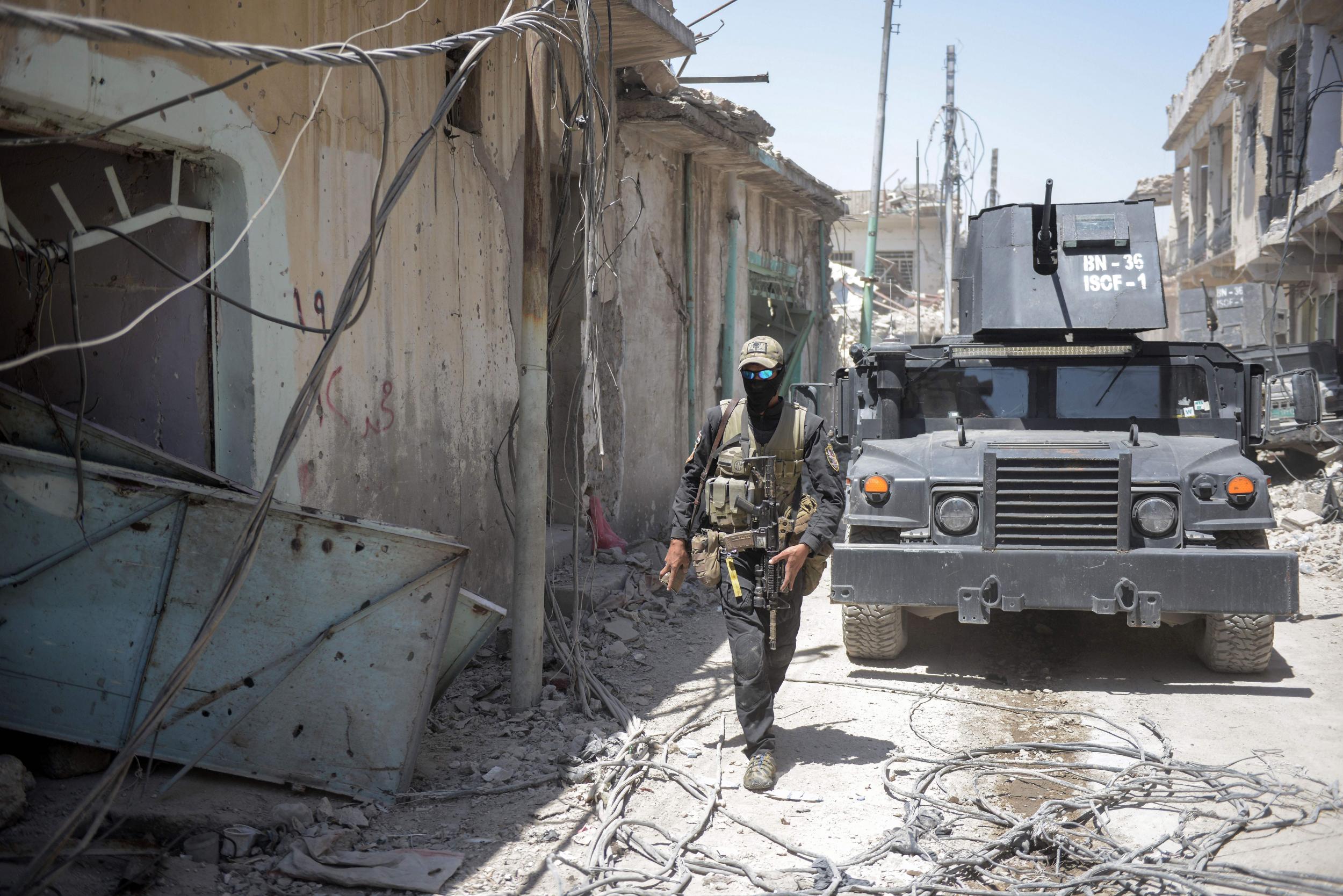 A member of the Iraqi armed forces during their advance against Isis through the Old City of Mosul