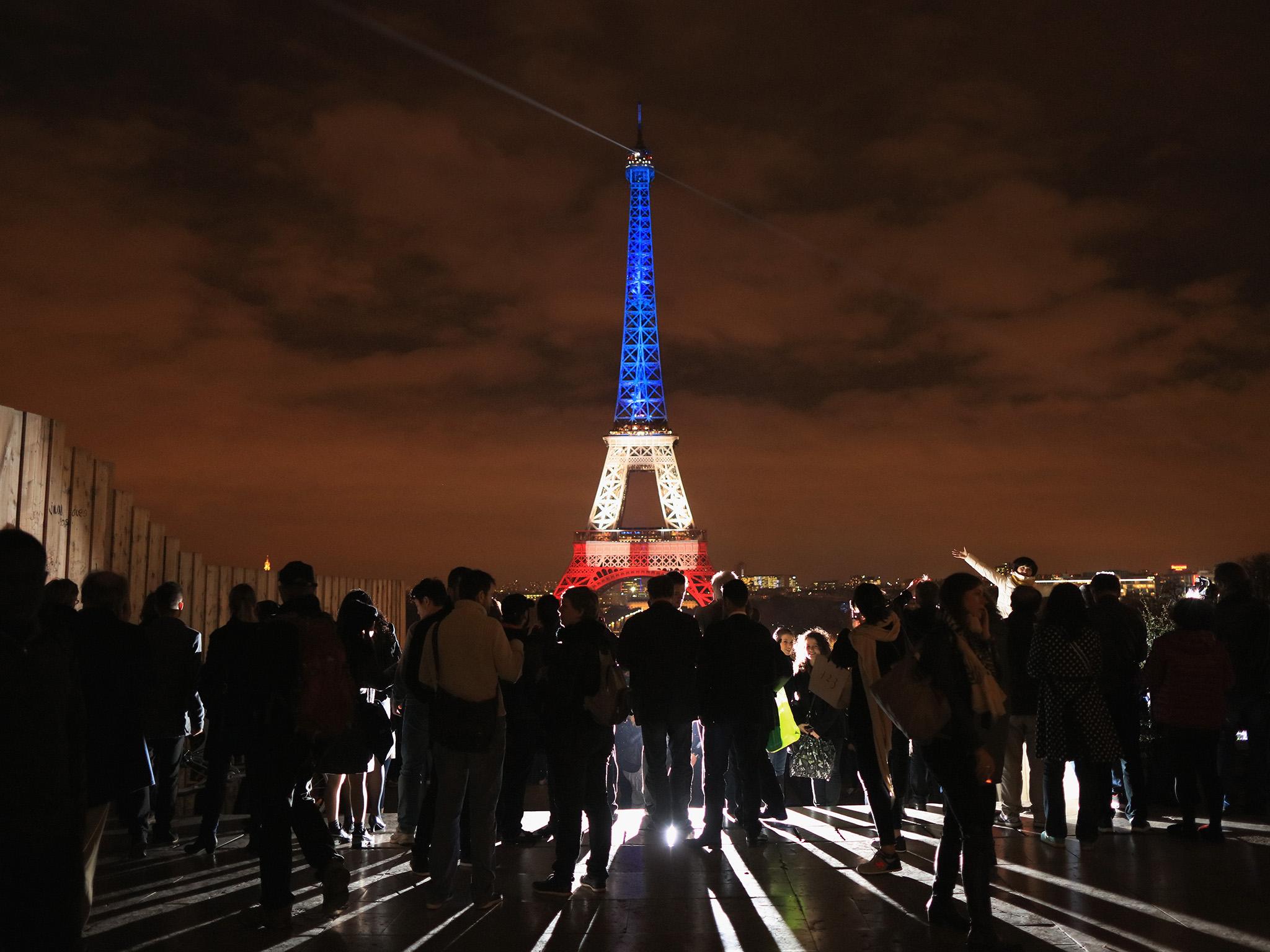The Eiffel Tower is illuminated in red, white and blue in honour of the victims of the Paris terrorist attacks in November 2015