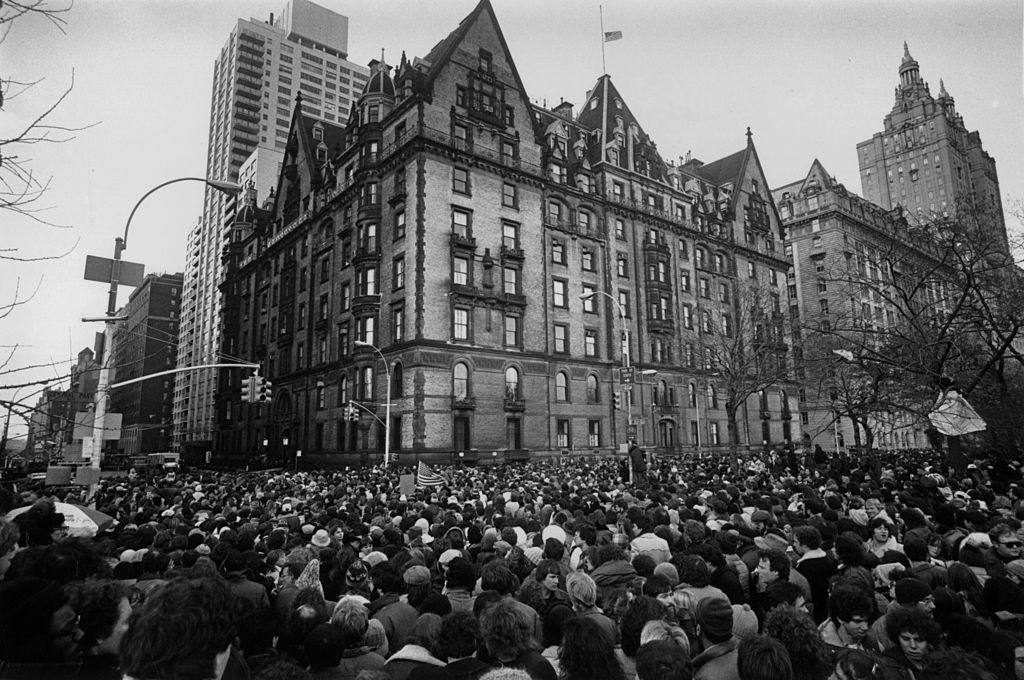 Dakota building 1980: crowds gather outside the home of John Lennon after news that he had been shot and killed (Getty)