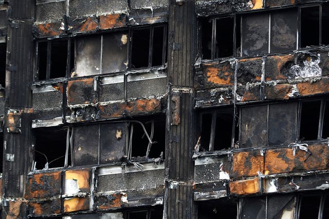 A damaged facade of Grenfell tower following the catastrophe in north Kensington