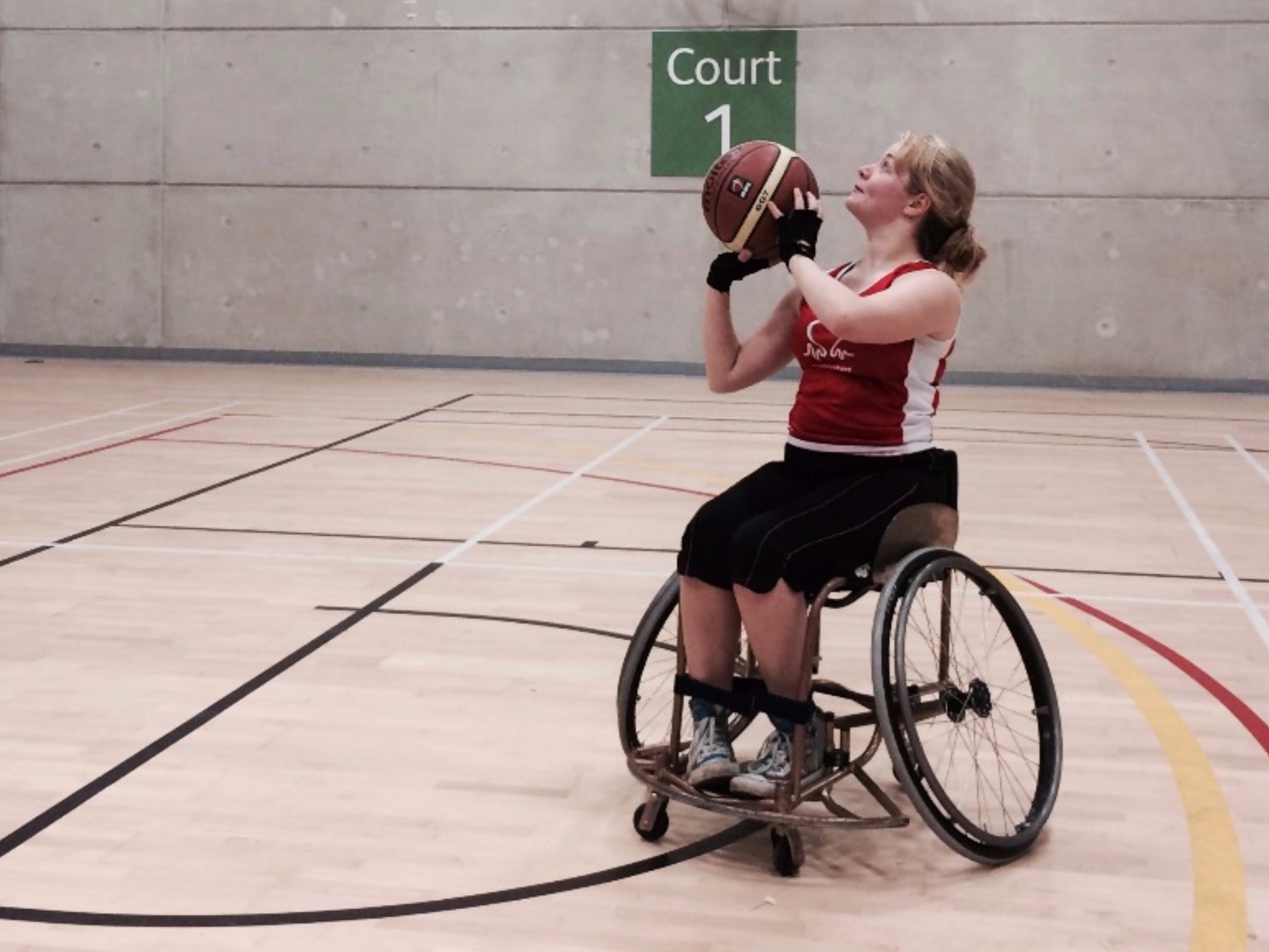 Dr Hannah Barham-Brown plays basketball in her crowdfunded wheelchair