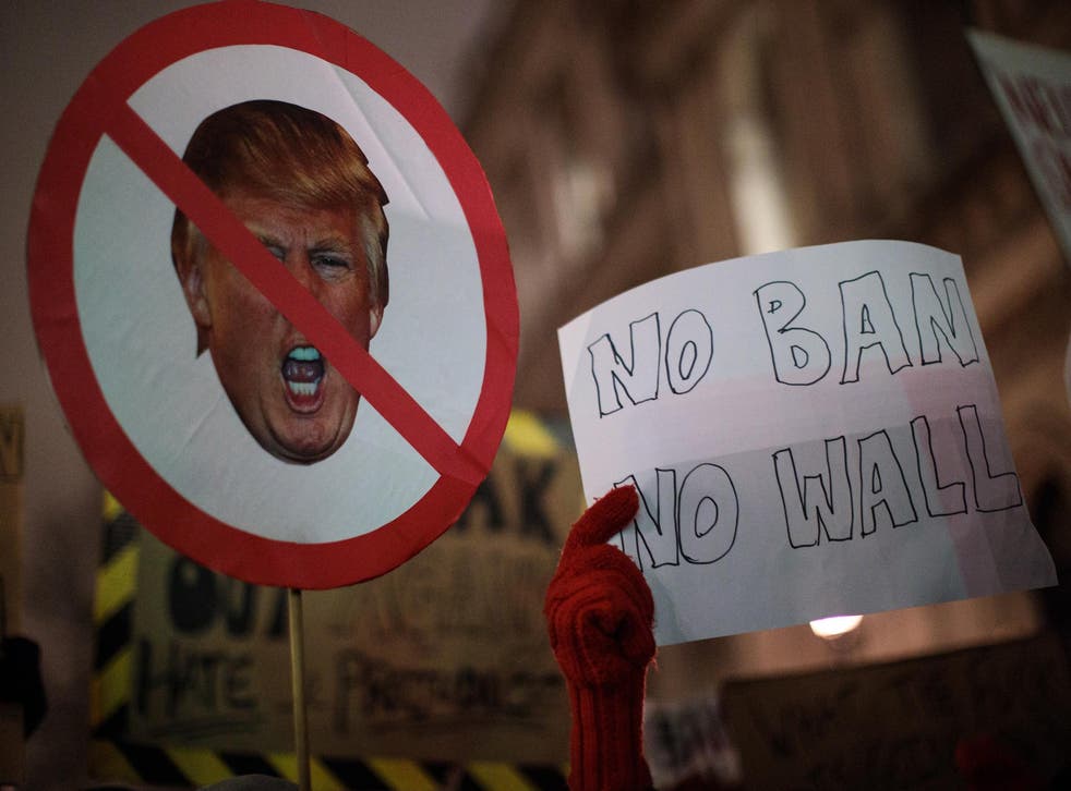 Demonstrators hold up placards during a protest in January outside Downing Street against President Donald Trump's ban on travel from seven Muslim countries