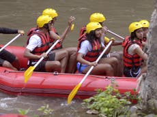 Barack Obama and family go river rafting on holiday in Indonesia