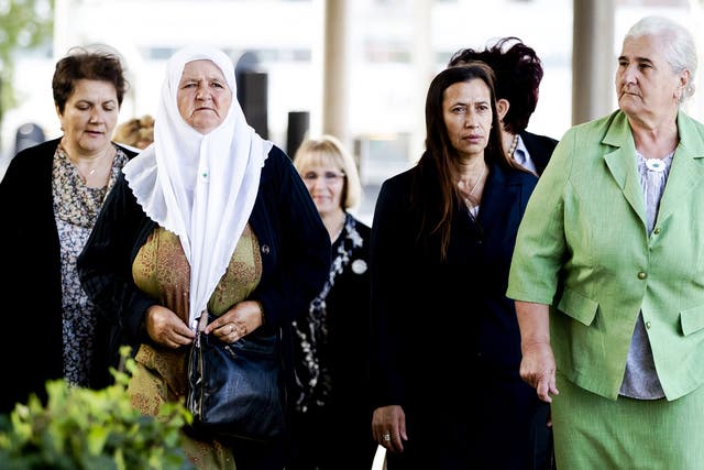 Bosnian women from the Srebrenica Mothers Association arrive at the Court of Justice in The Hague on Tuesday for the verdict of the appeal against the Dutch state