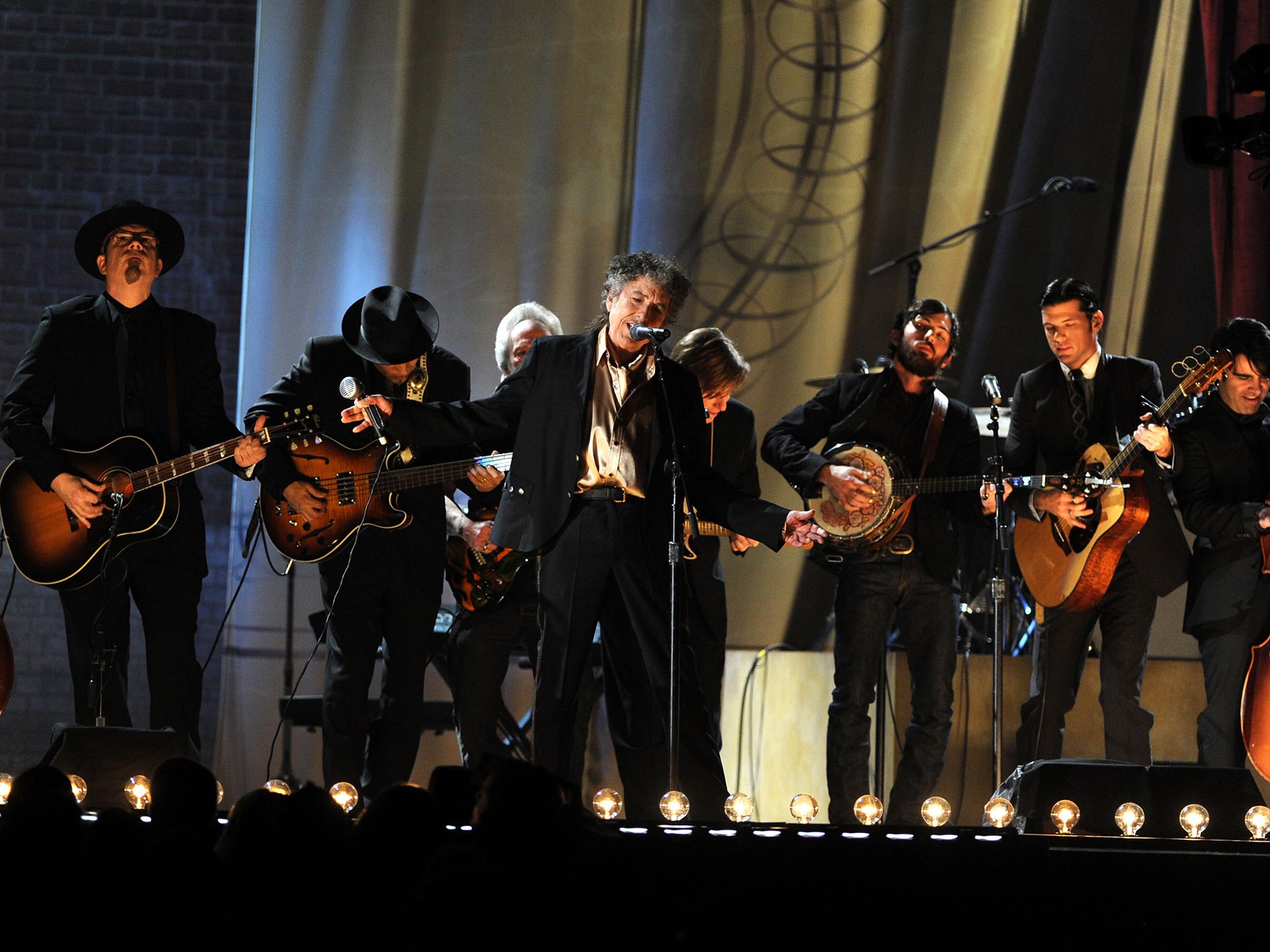 Mumford &amp; Sons perform with Bob Dylan at the 2011 Grammy Awards (Getty)