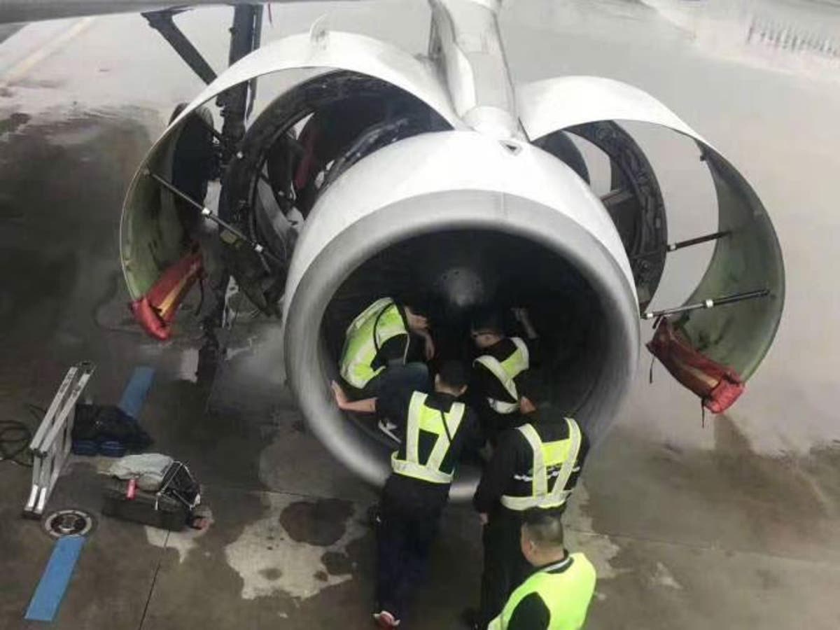 Woman holds up flight by throwing coins into jet engine for good luck