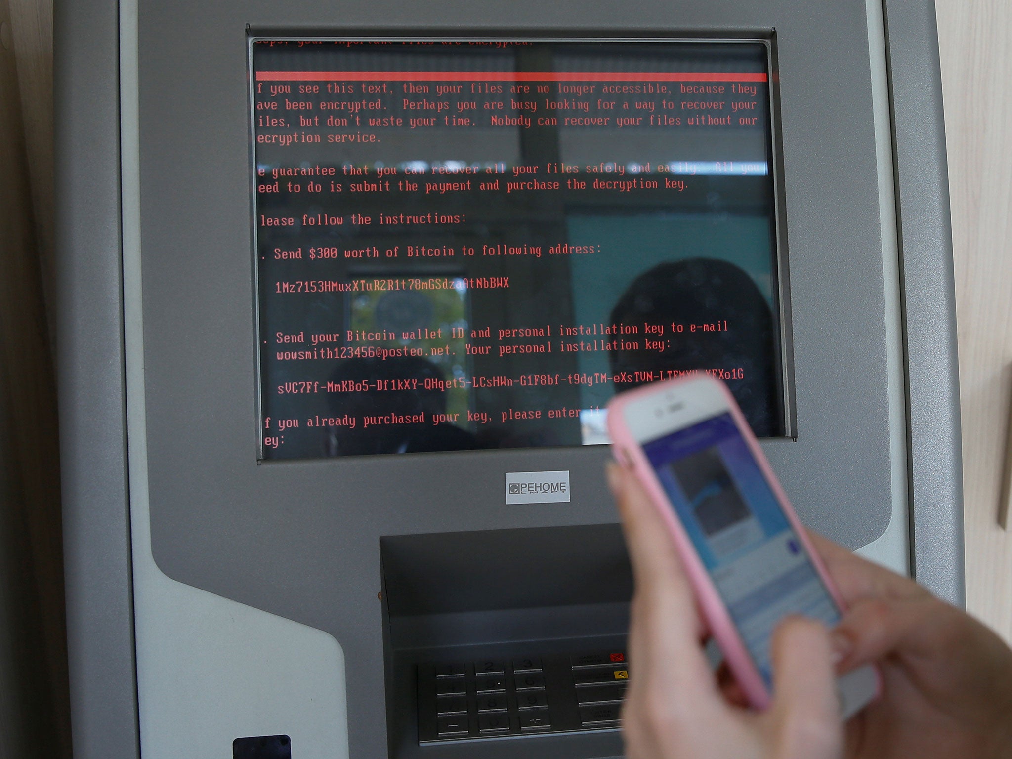 A message demanding money is seen on a monitor of a payment terminal at a branch of Ukraine's state-owned bank Oschadbank after a wave of cyber attacks, in Kiev, Ukraine, June 27, 2017.